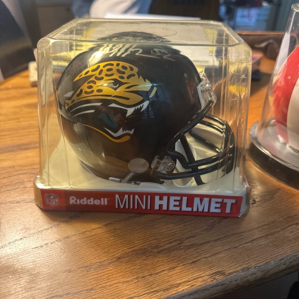 Black Jacksonville jaguars signed mini helmet